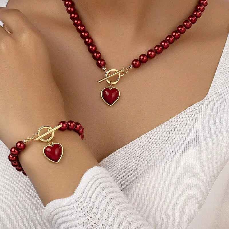 Halsband och armband med hjärta