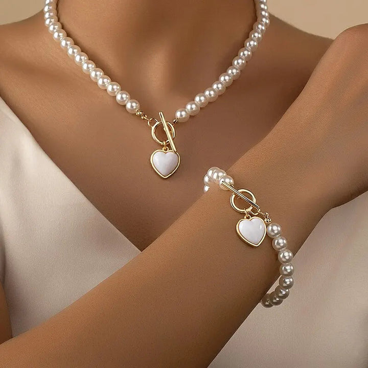 Halsband och armband med hjärta