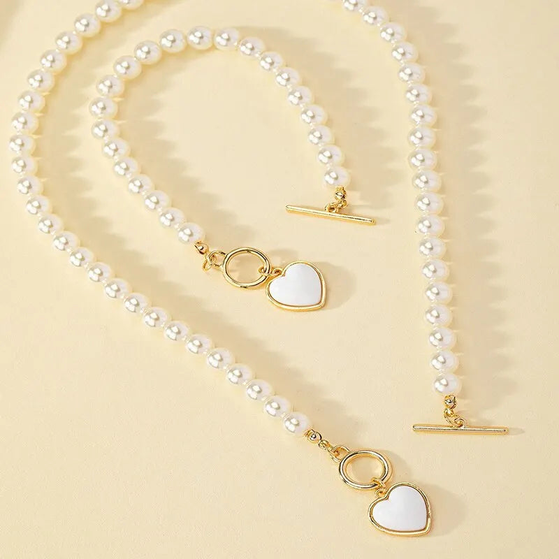 Halsband och armband med hjärta